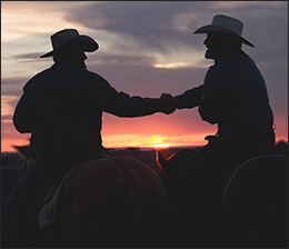 Image result for cowboys sunset shaking hands